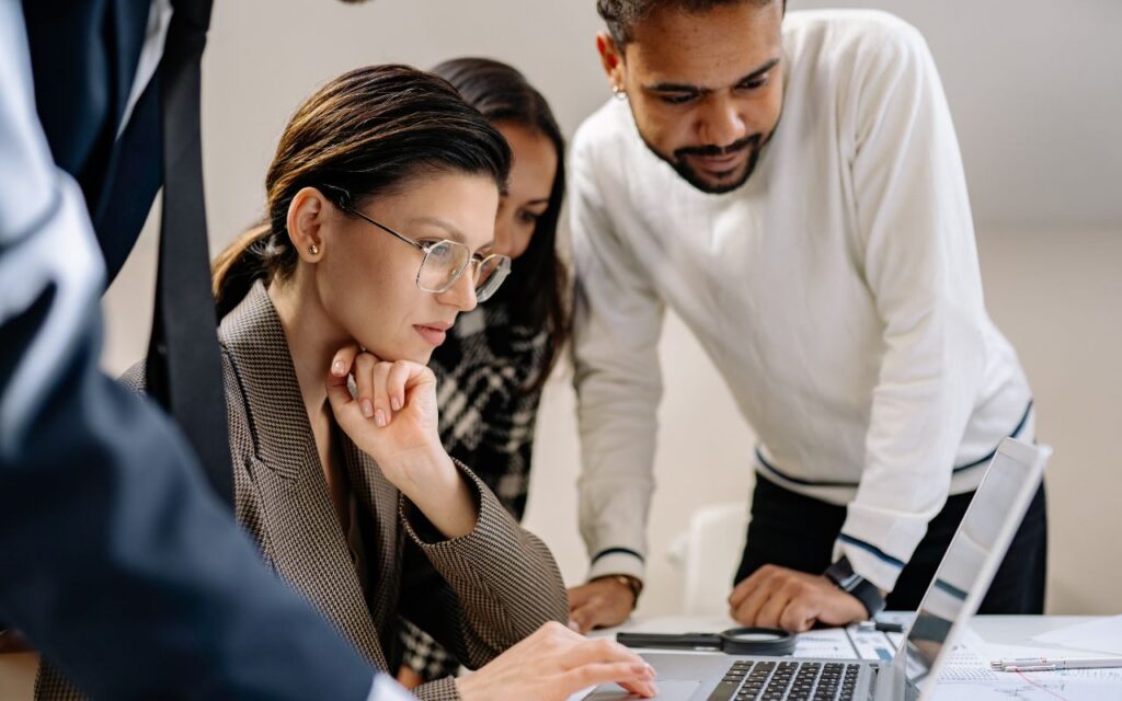 a group of people working at the office