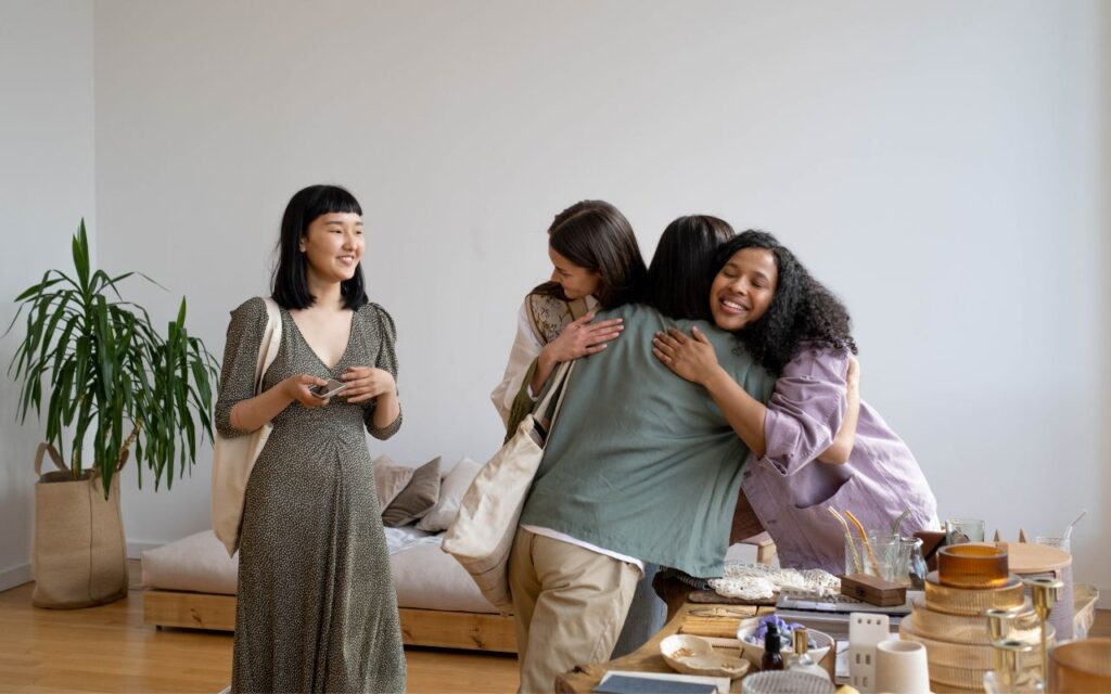 a group of women hugging