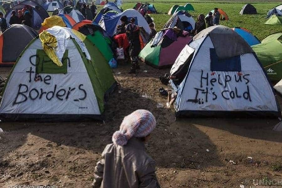 migrants in tents asking for food