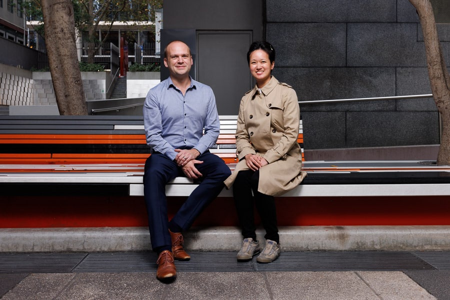 Two People Sitting in the Bench