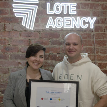 Adrienne (left) and Dave (right), pictured holding framed social enterprise certificate