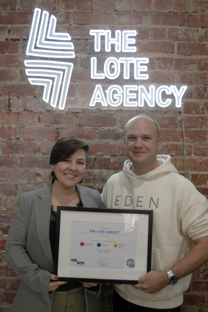 Adrienne (left) and Dave (right), pictured holding framed social enterprise certificate